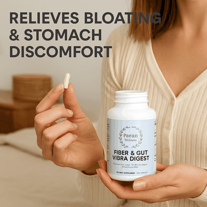Fiber & Gut Vibra Digest supplement bottle held by woman relieving bloating and stomach discomfort