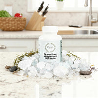 Ocean Pure Magnesium Glycinate supplement bottle surrounded by mineral crystals on kitchen countertop